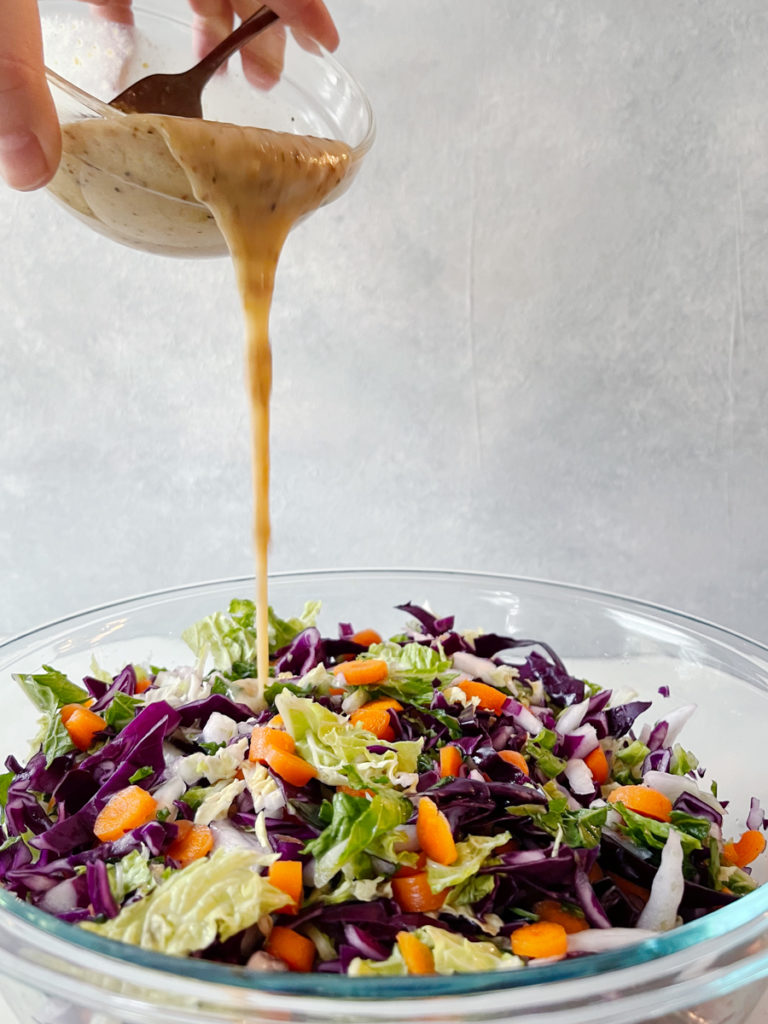 Pouring sauce on slaw